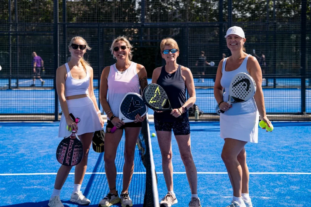 Players rallying on the padel court at Padel Tree Harlow